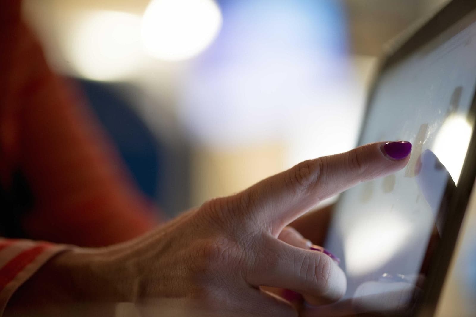 A hand using a tablet.